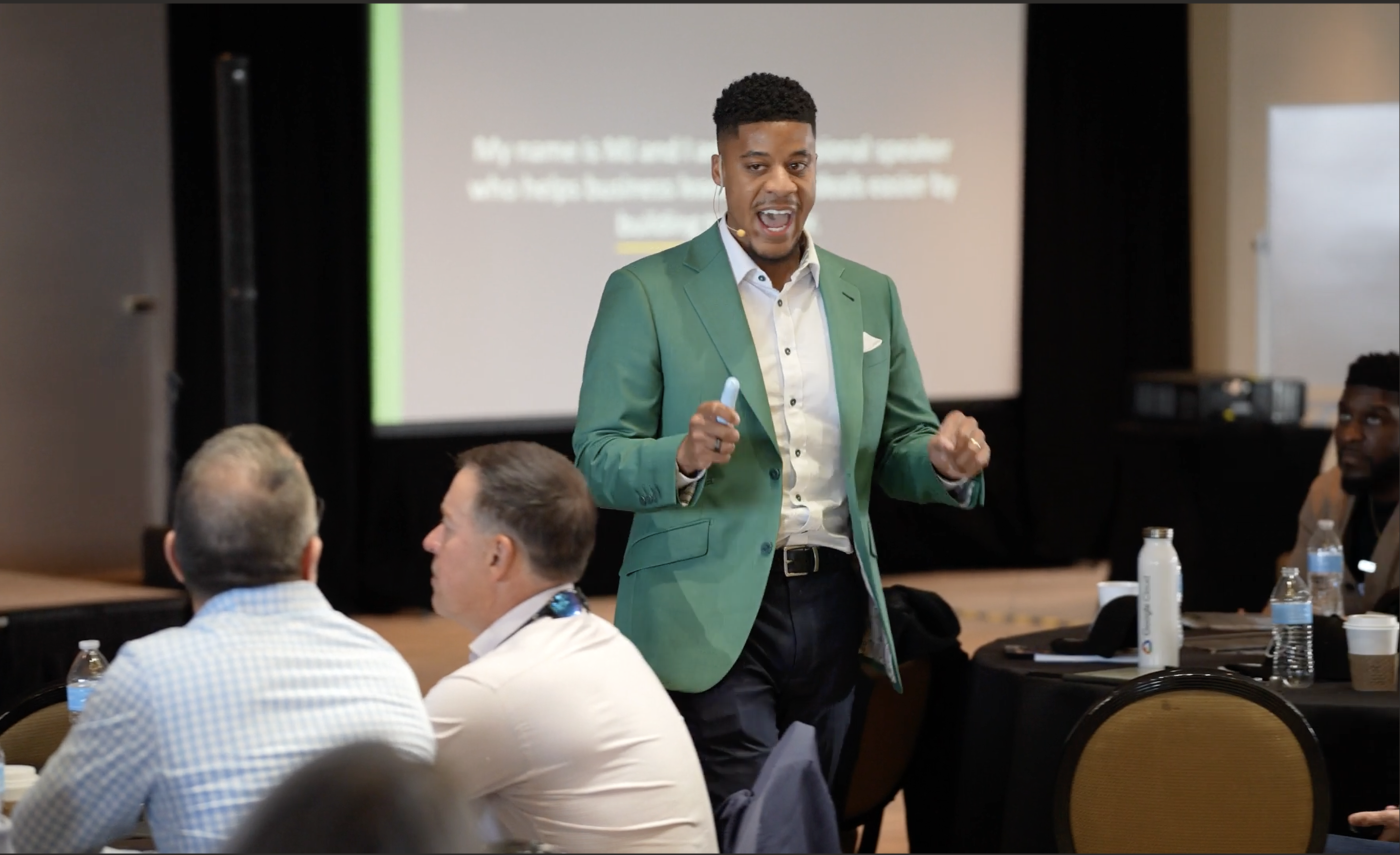 MJ Pittman delivering the Win Anyway keynote on stage