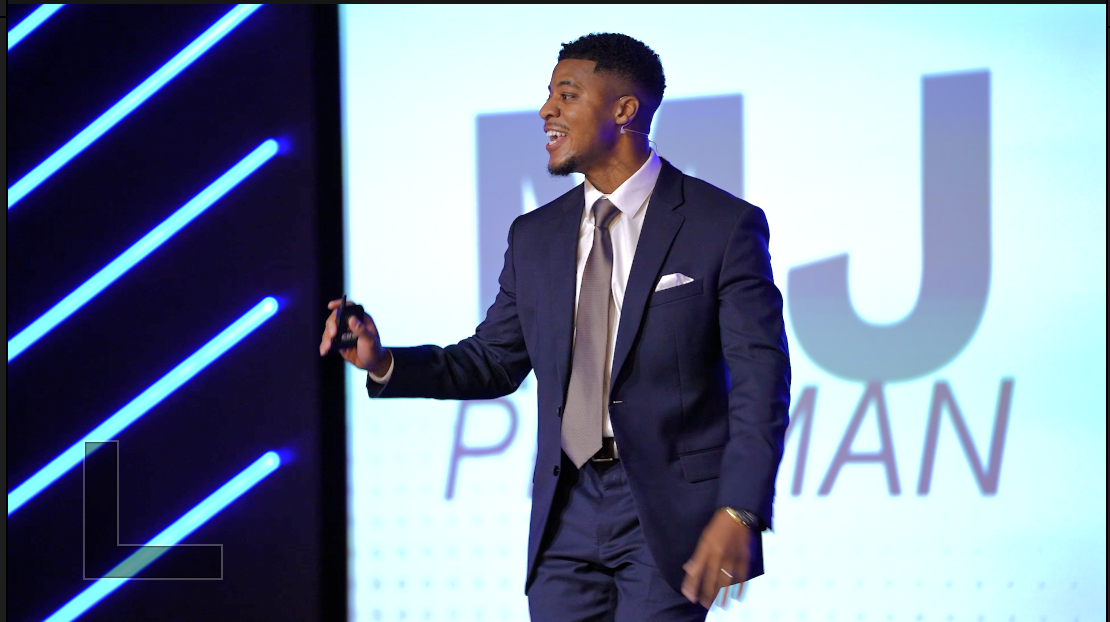 MJ Pittman speaking on stage